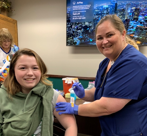Flagler Nurse gives Flu shot