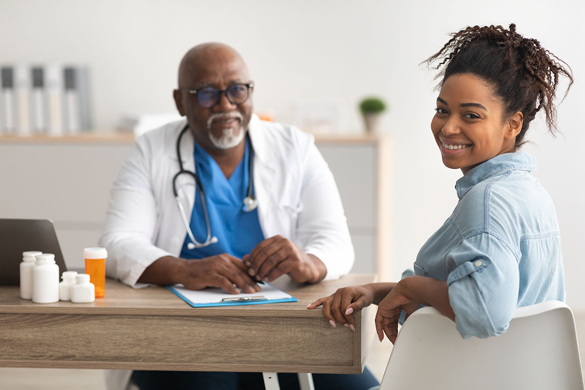 Woman speaking with a Doctor.